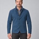 Front cropped view of a man wearing a blue four-button blazer with a stand collar and two welt pockets
