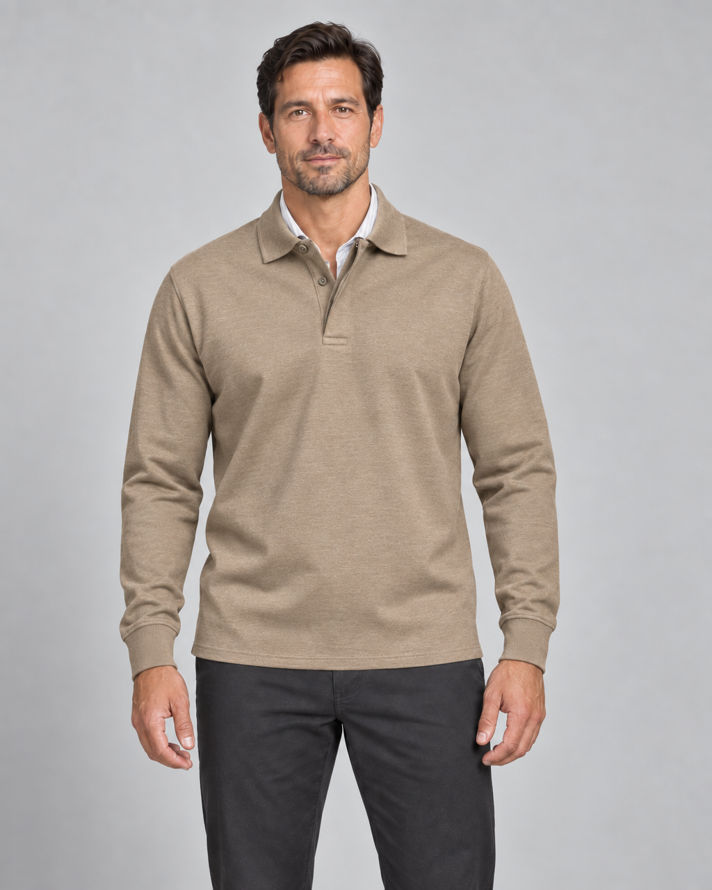 Front cropped view of a model wearing a khaki long-sleeve polo shirt with a buttoned collar