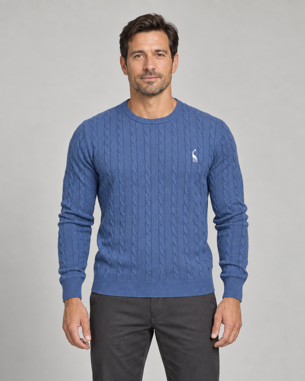 Front cropped view of a blue cable-knit crew-neck jumper with a small white chest motif