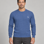 Front cropped view of a blue cable-knit crew-neck jumper with a small white chest motif