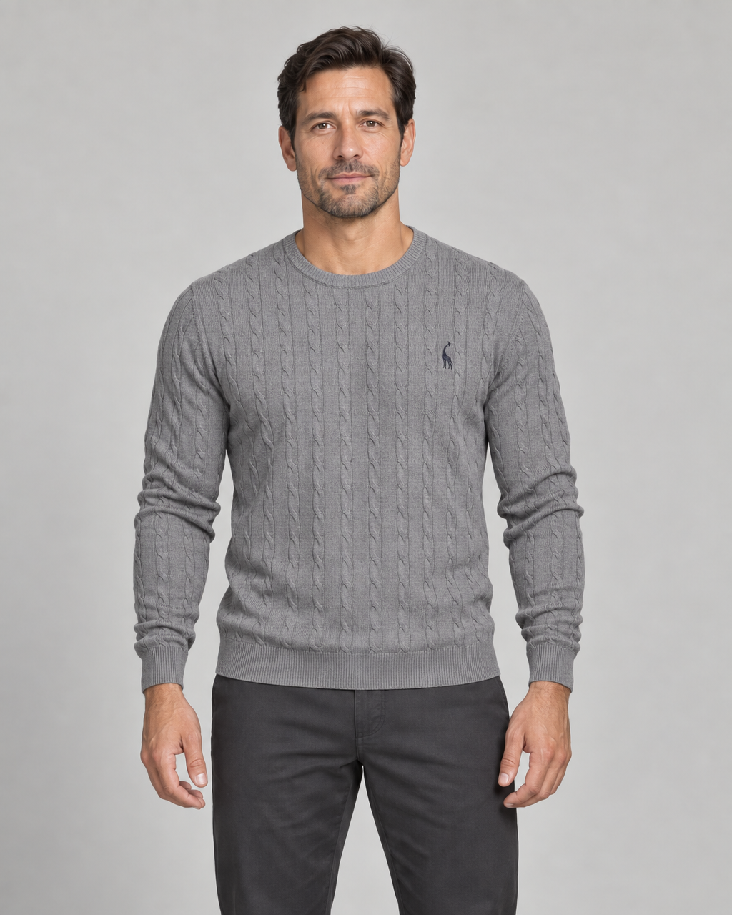 Grey cable-knit crew-neck jumper, shown from the front, with ribbed trims and a small dark chest motif.