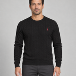 Front cropped view of a black cable-knit crew-neck jumper with a small red giraffe motif on the chest.