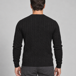 Cropped rear view of a model wearing a black cable-knit crew-neck jumper
