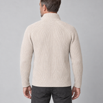 Back view of a man wearing a beige ribbed roll-neck jumper with long sleeves