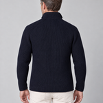Back view of a man wearing a dark navy rib-knit jacket with a high collar and long sleeves.