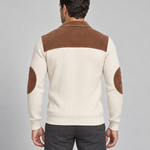 Back view of a beige ribbed sweater with a brown shoulder yoke, collar and oval elbow patches.