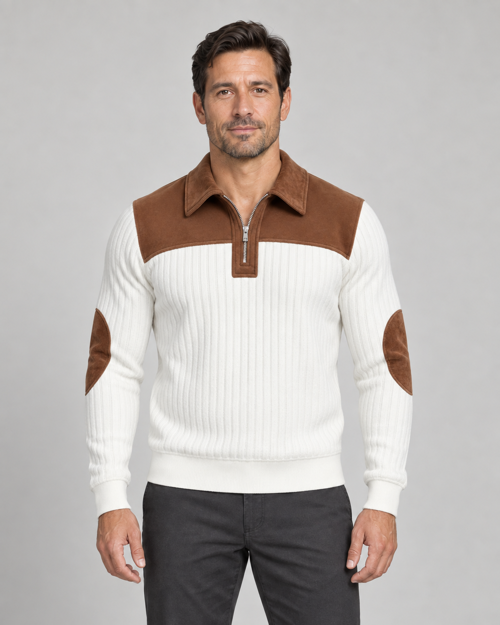 Front cropped view of a white ribbed jumper with a brown shoulder yoke, zip collar and elbow patches.