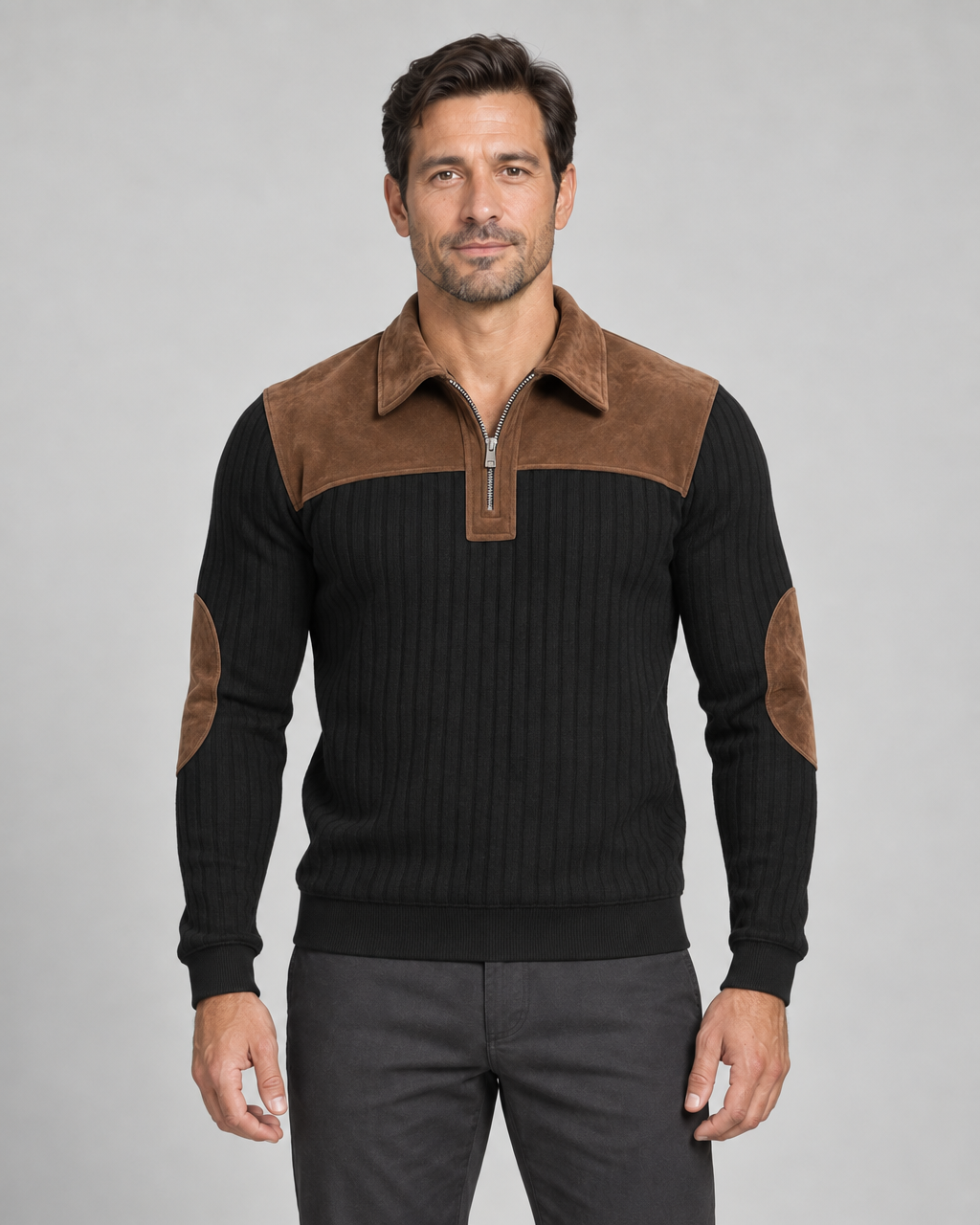 Front view of a black ribbed quarter-zip jumper with a brown collar, shoulder yoke and elbow patches.