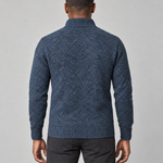 Back view of a man wearing a blue textured knit jumper with a ribbed high neck, cuffs and hem