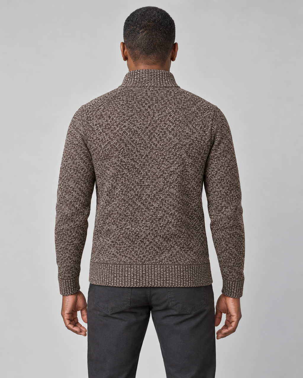 Back view of a brown speckled high-neck sweater with ribbed collar, cuffs and hem