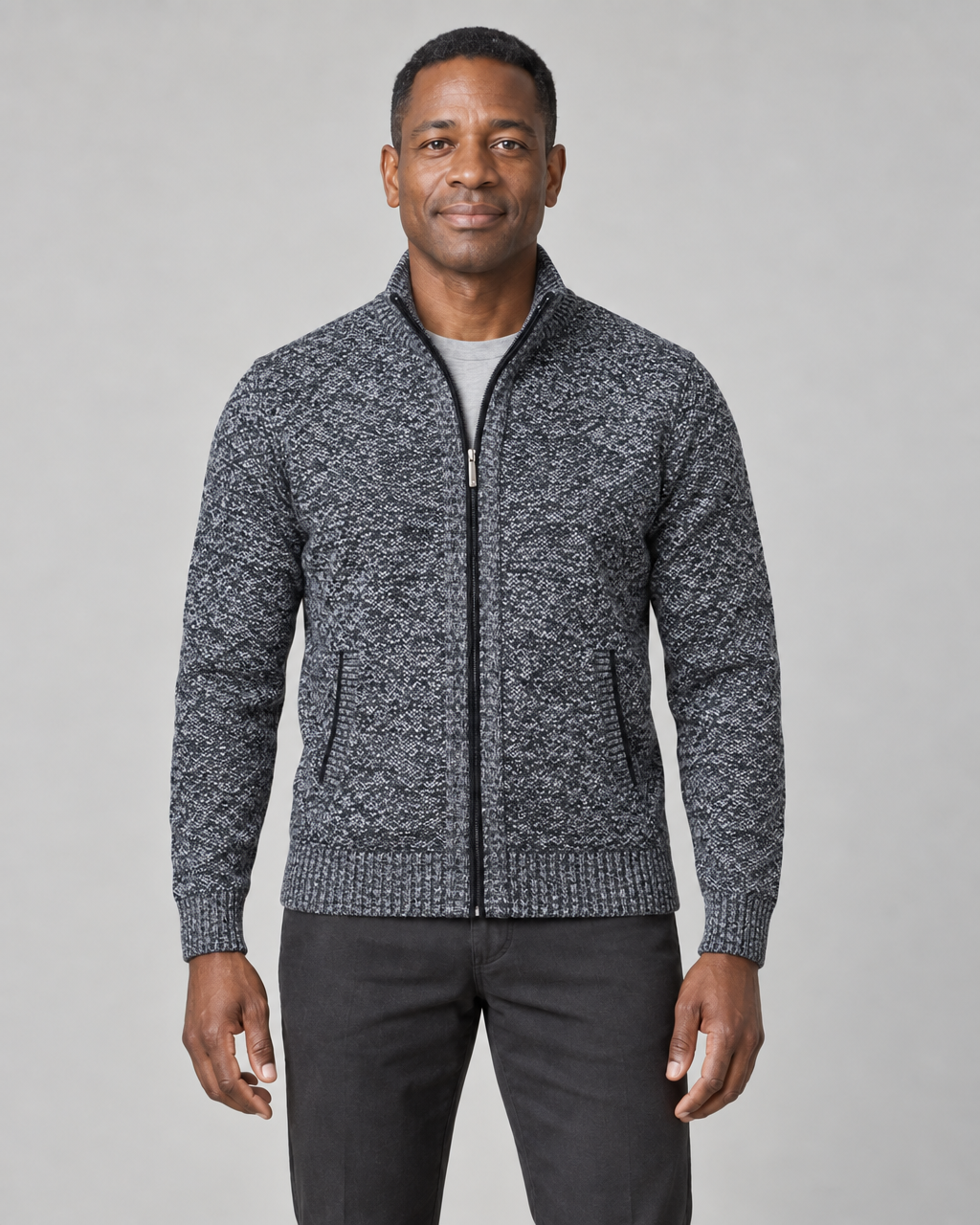 Front cropped view of a dark grey mottled zip-up men's sweater with a stand collar and two side pockets.