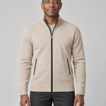 Front cropped view of a men's light khaki zip-up sweater with a stand collar and black zip and pocket trims.