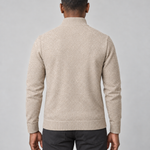 Back view of a man wearing a light beige textured jumper with a ribbed high neck, cuffs and hem