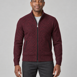 Front cropped view of a man wearing a wine red textured zip-up sweater with a stand collar