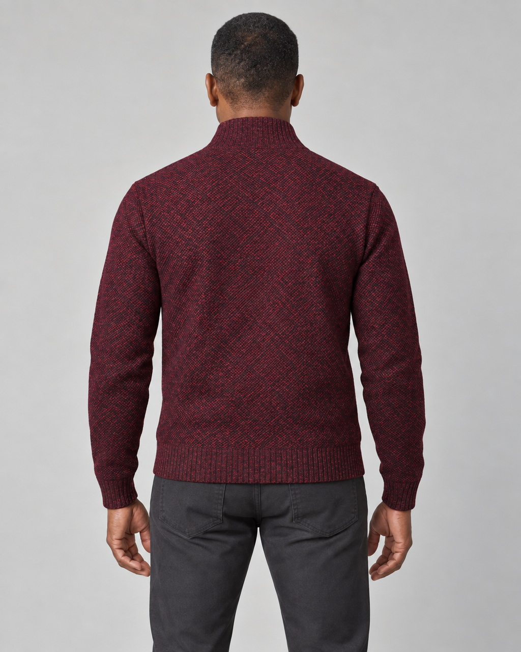 Cropped back view of a wine-red patterned jumper with a high ribbed collar, cuffs and hem.