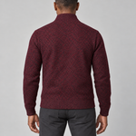 Cropped back view of a wine-red patterned jumper with a high ribbed collar, cuffs and hem.