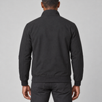 Cropped back view of a model wearing a black jacket with a raised collar and ribbed hem and cuffs