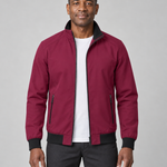 Front cropped view of a man wearing an open dark red jacket with black collar, cuffs, hem and zipped side pockets.