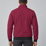 Back-view concept of a man wearing a burgundy jacket with a raised collar and black cuffs and hem.