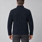 Conceptual back view of a man wearing a navy blue jacket with a stand collar.