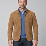 Front cropped view of a man wearing a brown blazer with a stand collar, four buttons and flap pockets
