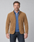 Front cropped view of a man wearing a brown blazer with a stand collar, four buttons and flap pockets