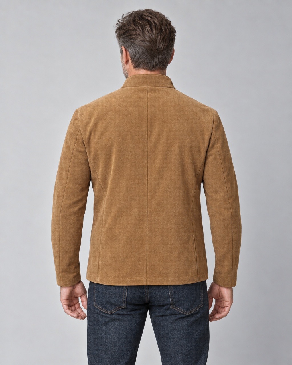Cropped rear view of a man wearing a brown blazer with a raised collar and long sleeves