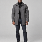 Full-body front view of a man wearing a grey button-front coat with a pointed collar and cuff tabs