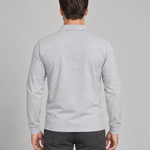 Back view of a man wearing a light grey long-sleeved collared shirt