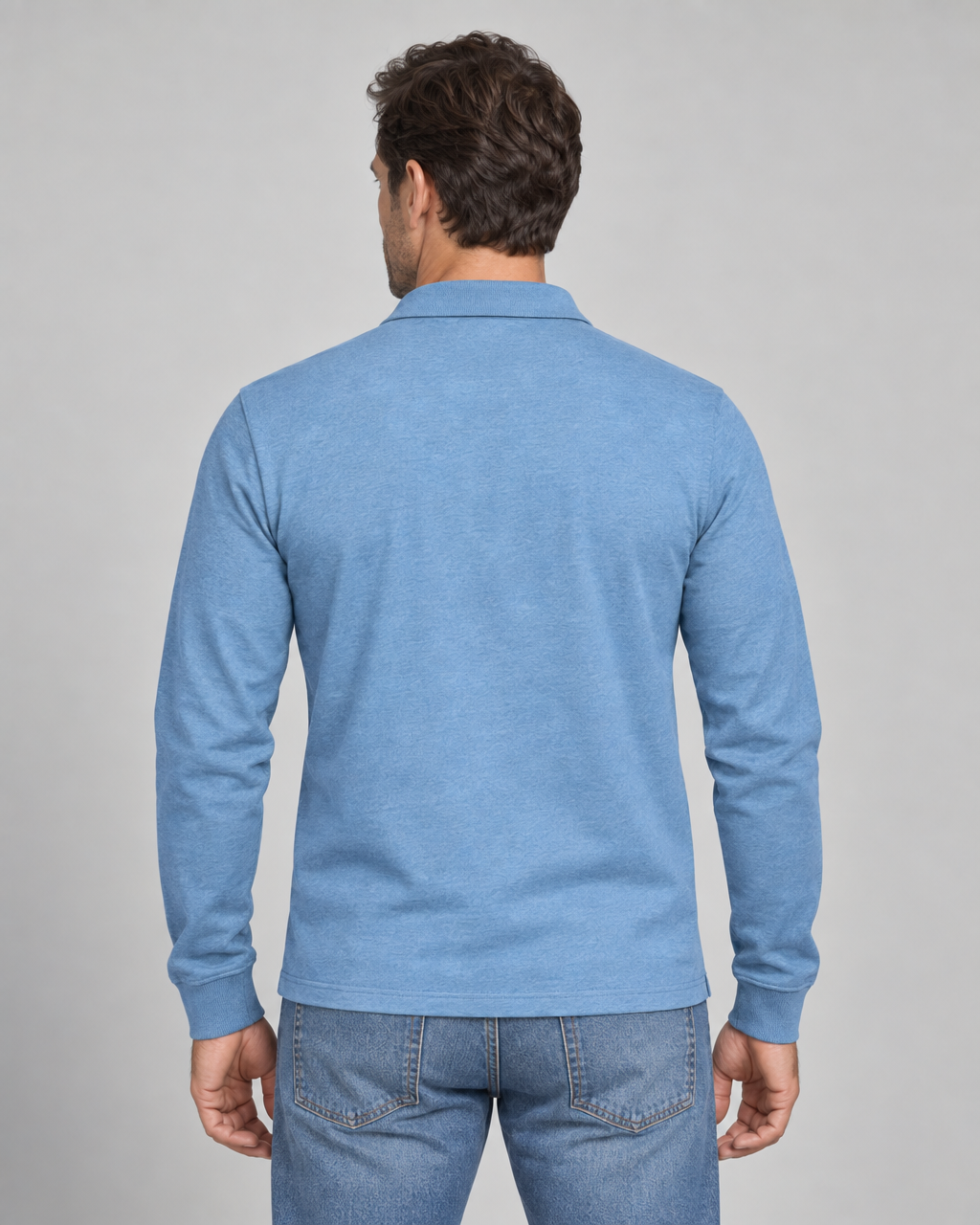 Back view of a light blue long-sleeve polo shirt with ribbed cuffs and a plain back