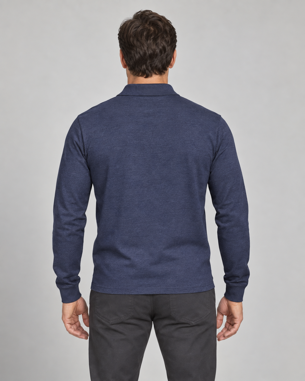 Back view of a model wearing a navy blue long-sleeved collared shirt