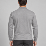 Back view of a model wearing a grey long-sleeved polo shirt.