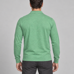 Rear view of a model wearing a green long-sleeved collared shirt, cropped from head to thighs.