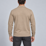 Back view of a model wearing a khaki long-sleeved collared shirt with a subtle tonal pattern